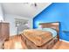 Comfortable bedroom with wooden furniture, natural light, and a soothing ambiance at 452 Waterwheel Falls Dr, Henderson, NV 89015