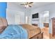 Relaxing bedroom with wood floors, walk-in closet, TV, and a full bathroom at 452 Waterwheel Falls Dr, Henderson, NV 89015