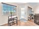 Cozy dining area with a small table, natural light, and easy access to the outdoors at 452 Waterwheel Falls Dr, Henderson, NV 89015
