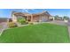 Inviting single level home showcasing a pristine lawn and covered patio at 452 Waterwheel Falls Dr, Henderson, NV 89015