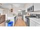 Modern kitchen with white countertops, stainless steel appliances, and an open layout at 452 Waterwheel Falls Dr, Henderson, NV 89015