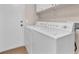 Bright laundry room with modern appliances and ample counter space and door to the exterior at 452 Waterwheel Falls Dr, Henderson, NV 89015