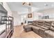 Inviting living space with a brown leather sofa and open design, ideal for relaxation at 452 Waterwheel Falls Dr, Henderson, NV 89015
