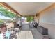 Covered outdoor patio with furniture, perfect for entertaining and relaxing at 452 Waterwheel Falls Dr, Henderson, NV 89015