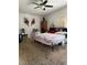 Bright bedroom featuring a ceiling fan, carpeted floors, and decor at 5065 Celebrity Cir, Las Vegas, NV 89119