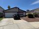 Charming single-story home featuring a two-car garage and a well-maintained front yard at 5065 Celebrity Cir, Las Vegas, NV 89119
