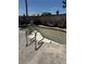 An empty outdoor pool with poolside seating and a surrounding concrete patio invites relaxation and entertainment at 5065 Celebrity Cir, Las Vegas, NV 89119