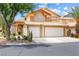 Charming two-story home featuring a two-car garage and desert landscaping in the front yard at 5449 Desert Spring Rd, Las Vegas, NV 89149