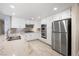Bright kitchen featuring granite countertops, stainless steel appliances and white cabinetry at 5449 Desert Spring Rd, Las Vegas, NV 89149