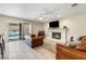 Bright living room featuring a fireplace, access to the pool, and neutral tile floors at 5449 Desert Spring Rd, Las Vegas, NV 89149