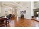 Spacious living room with hardwood floors, large windows, and modern decor at 5449 Desert Spring Rd, Las Vegas, NV 89149
