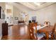 Open living space with hardwood floors, dining table, and ample natural light at 5449 Desert Spring Rd, Las Vegas, NV 89149