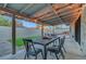 Inviting covered back patio with outdoor dining and lounge area, perfect for entertaining at 58 Pleasant Dale Dr, Henderson, NV 89074