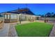 Enjoy this backyard with its lush green lawn and covered patio, perfect for outdoor entertaining at 58 Pleasant Dale Dr, Henderson, NV 89074