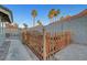 Backyard featuring a wooden fence, low-maintenance landscaping and access gate at 58 Pleasant Dale Dr, Henderson, NV 89074