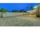 Expansive backyard with brick flooring, covered patio and lawn, providing ample space for recreation at 58 Pleasant Dale Dr, Henderson, NV 89074