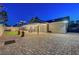 Great backyard view of its covered patio, and well-manicured lawn, perfect for outdoor gatherings at 58 Pleasant Dale Dr, Henderson, NV 89074