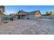 Aerial view of backyard with patio, covered dining, lounge, firepit and artificial grass at 58 Pleasant Dale Dr, Henderson, NV 89074