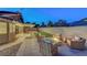 Inviting backyard features a cozy seating area with a modern fire pit and manicured landscaping at 58 Pleasant Dale Dr, Henderson, NV 89074