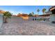 Expansive backyard patio with brick pavers, covered area, and well-maintained landscaping at 58 Pleasant Dale Dr, Henderson, NV 89074