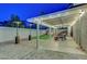 The covered patio includes a dining area, fire pit, and seating, complete with landscape views at 58 Pleasant Dale Dr, Henderson, NV 89074