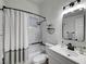Bathroom featuring a shower-tub combo, vanity with sink, and modern fixtures at 58 Pleasant Dale Dr, Henderson, NV 89074