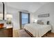 Well-lit bedroom with a comfortable bed, light walls, and natural light at 58 Pleasant Dale Dr, Henderson, NV 89074