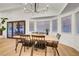 Bright dining area with modern lighting, access to the backyard and a bay window at 58 Pleasant Dale Dr, Henderson, NV 89074