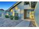 Welcoming front entrance with a decorative door, manicured shrubs, and beautiful brick pathway at 58 Pleasant Dale Dr, Henderson, NV 89074