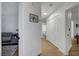 Bright hallway leads to bedrooms and bathrooms with light hardwood flooring at 58 Pleasant Dale Dr, Henderson, NV 89074