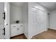 Hallway view with closet, cabinets, and neutral paint at 58 Pleasant Dale Dr, Henderson, NV 89074