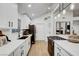 Bright kitchen featuring white cabinetry, modern appliances, and sleek countertops at 58 Pleasant Dale Dr, Henderson, NV 89074