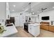 Bright kitchen boasts modern appliances, an island with a cooktop, and sleek countertops at 58 Pleasant Dale Dr, Henderson, NV 89074