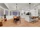Open concept showcasing a modern kitchen with bar seating and adjacent dining area at 58 Pleasant Dale Dr, Henderson, NV 89074