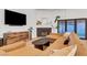 Comfortable living room featuring a fireplace, a sleek entertainment unit, and seamless flow to the outdoor space at 58 Pleasant Dale Dr, Henderson, NV 89074