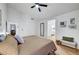 Bright main bedroom with a ceiling fan and a view into the main bathroom at 58 Pleasant Dale Dr, Henderson, NV 89074
