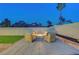 Outdoor seating with a fire pit on the patio and well-maintained landscaping at 58 Pleasant Dale Dr, Henderson, NV 89074