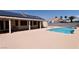 Backyard featuring a sparkling pool, covered patio, and solar panels at 6016 Bungalow Bay St, Las Vegas, NV 89130