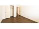 Bright bedroom features an ample closet and beautiful wood-look flooring at 6016 Bungalow Bay St, Las Vegas, NV 89130