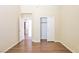 Bedroom with wood floors, closet, and doorway to other rooms at 6016 Bungalow Bay St, Las Vegas, NV 89130