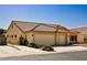 Beautiful single-story home featuring a tile roof, desert landscaping, and a three-car garage at 6016 Bungalow Bay St, Las Vegas, NV 89130