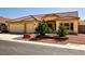 Charming single-story home featuring a tile roof, desert landscaping, and a three-car garage at 6016 Bungalow Bay St, Las Vegas, NV 89130