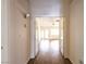 Entryway hallway leading to bright living room with ceiling fan at 6016 Bungalow Bay St, Las Vegas, NV 89130