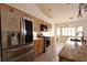 Bright kitchen featuring stainless steel appliances, stone countertops and wood cabinets at 6016 Bungalow Bay St, Las Vegas, NV 89130