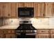 Up-close kitchen view highlighting the modern appliances and light wooden cabinetry with matching countertops at 6016 Bungalow Bay St, Las Vegas, NV 89130