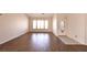 Spacious living room with ample natural light and wood-look flooring at 6016 Bungalow Bay St, Las Vegas, NV 89130