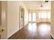 Bright living room features wood floors, ceiling fan, and bay window with ample natural light at 6016 Bungalow Bay St, Las Vegas, NV 89130