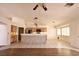 Spacious open-concept living room with tile flooring, a breakfast bar and plenty of natural light at 6016 Bungalow Bay St, Las Vegas, NV 89130