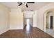 Open living room featuring wood floors, high ceilings, and neutral walls, creating a bright and airy space at 6016 Bungalow Bay St, Las Vegas, NV 89130