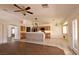 Spacious open-concept living room with tile flooring, a breakfast bar and plenty of natural light at 6016 Bungalow Bay St, Las Vegas, NV 89130